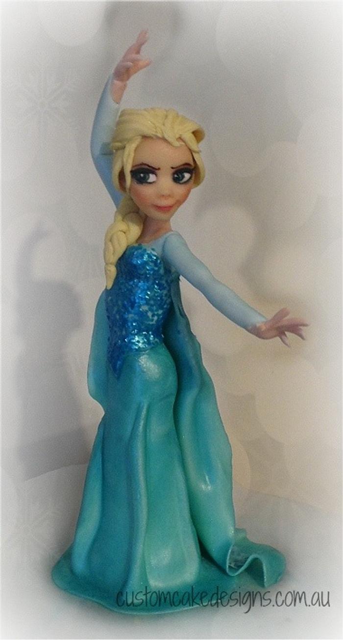 Fondant Elsa - Decorated Cake by Custom Cake Designs - CakesDecor