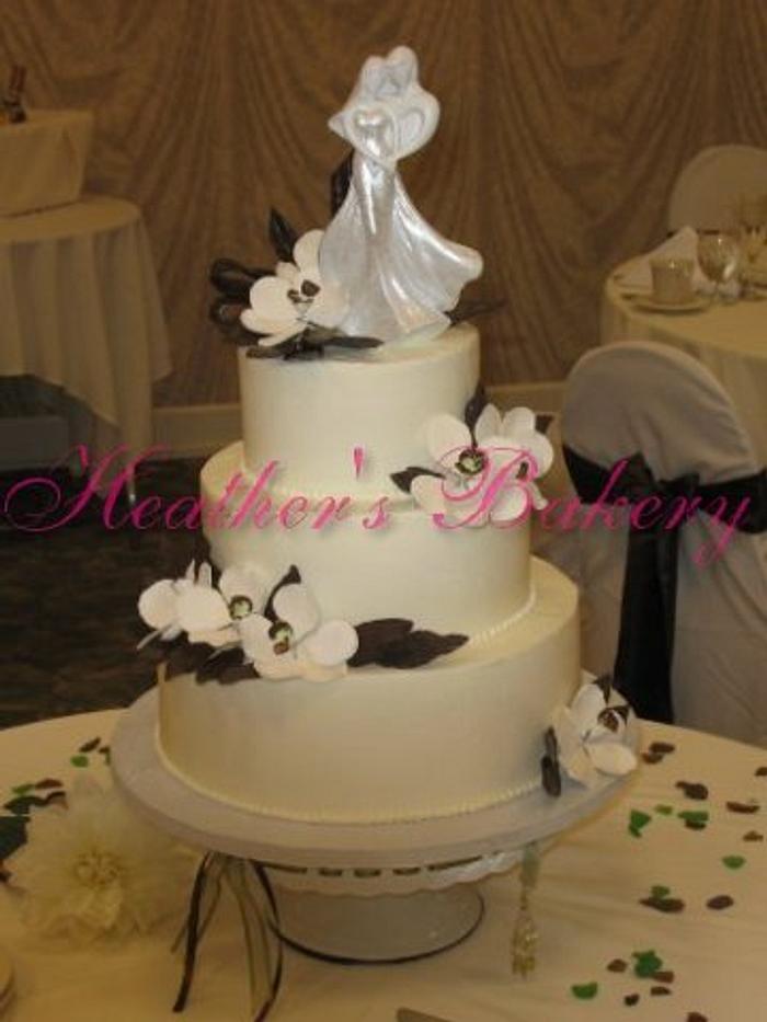 Buttercream with Gumpaste Flowers and Chocolate Leaves and Ribbon