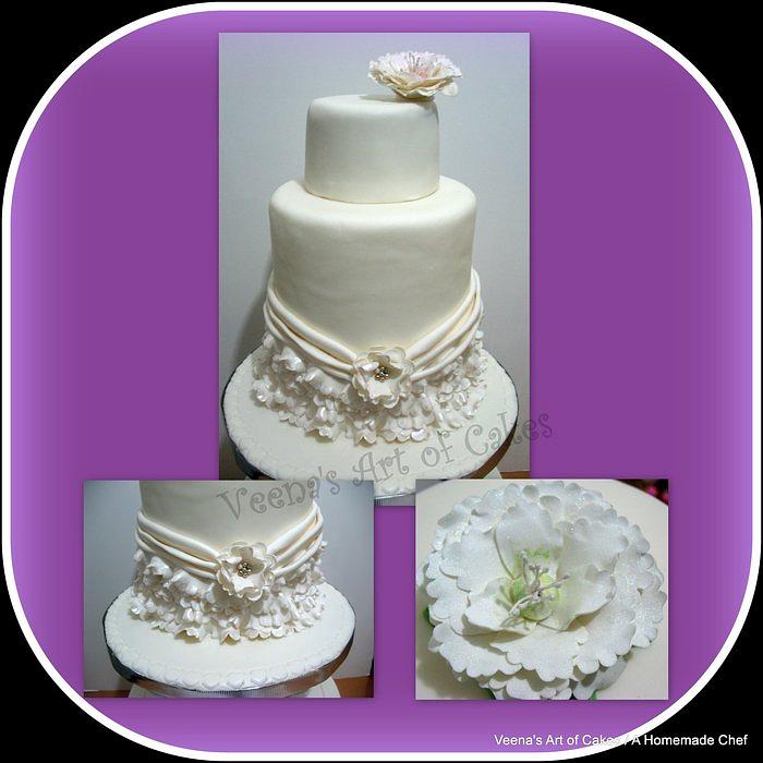 A Double Barrel Wedding cake with Frills and a sugar Peony