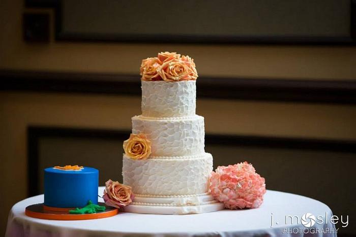 Rustic butter cream wedding cake with fresh flowers