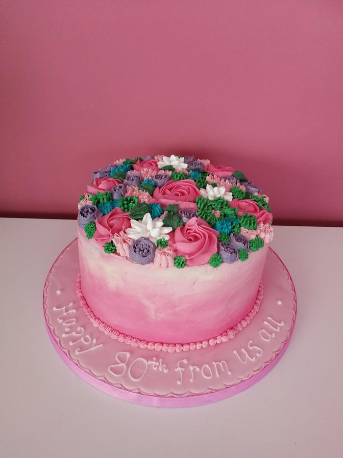 Bright piped flowers cake