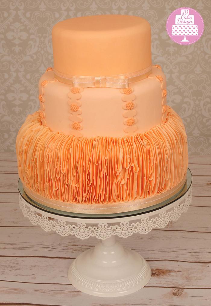 Peach ruffle wedding cake