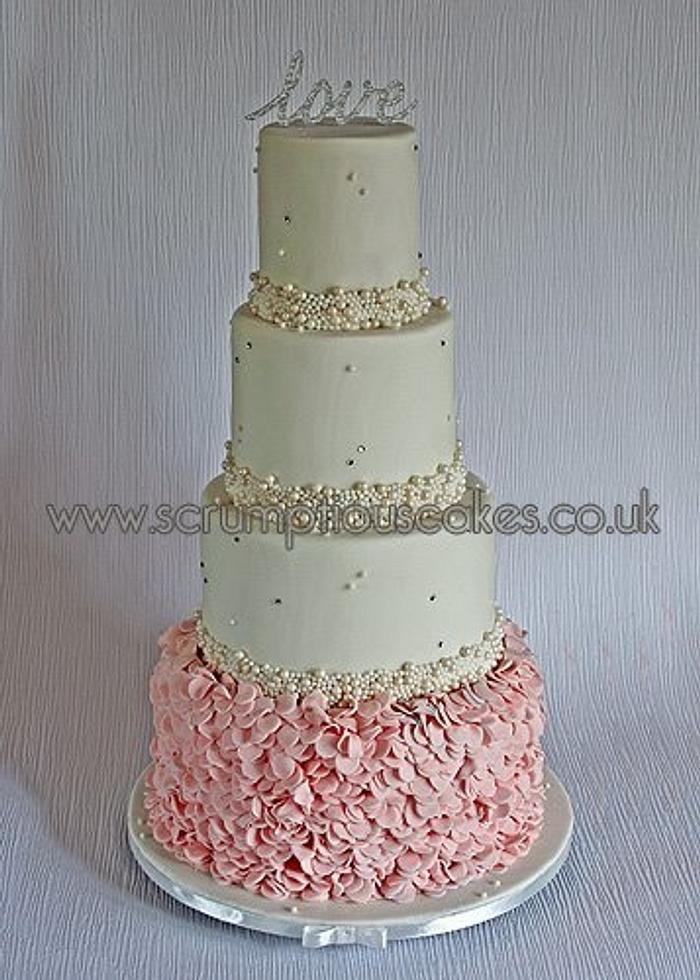Blush Pink Ruffles and Ivory Pearls Weddng Cake