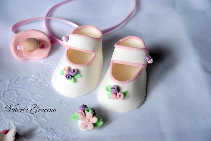 Baby shoes for christening cake