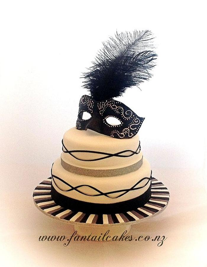 Masquerade engagement cake with edible mask
