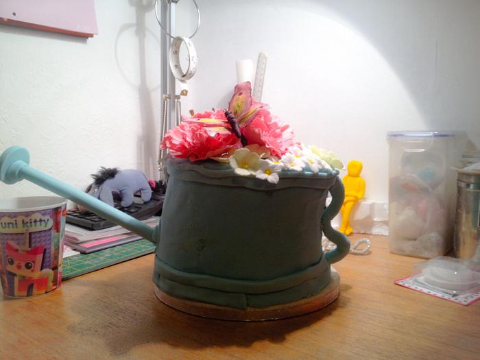 Watering can with flowers