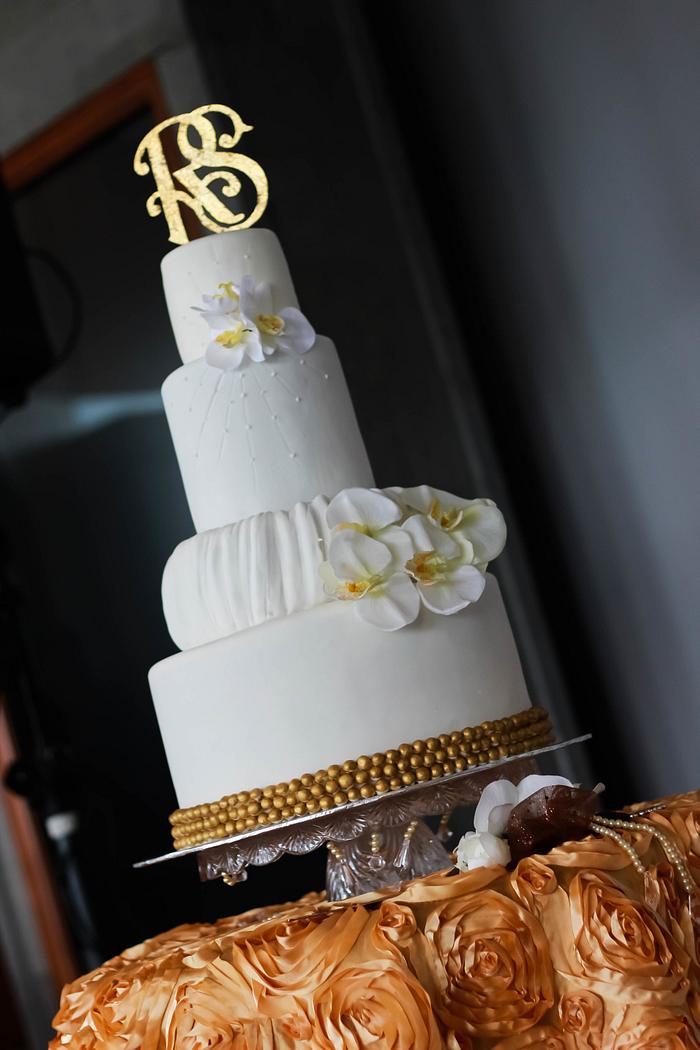 Gold and white wedding cake