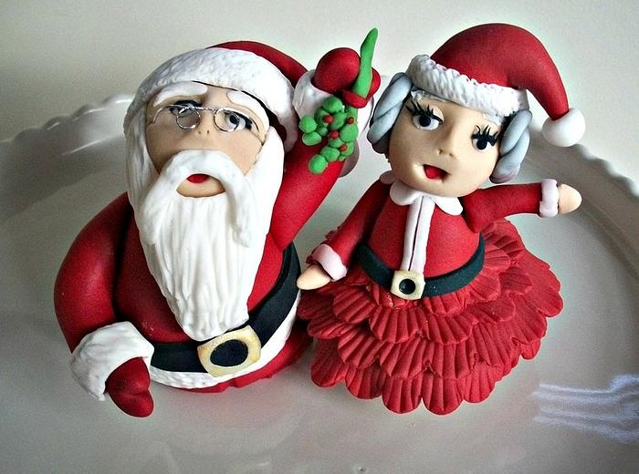 Santa and Mrs. Claus under the mistletoe