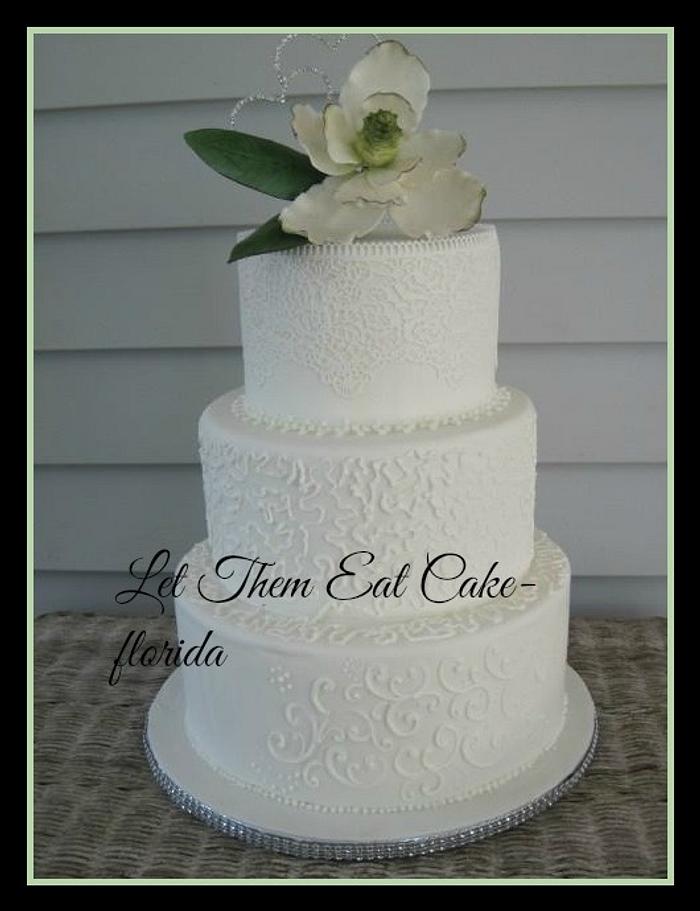 magnolia, lace and scrollwork project cake