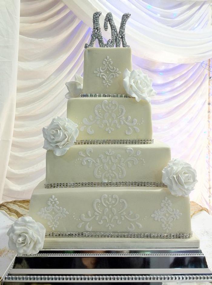Four tier white on ivory wedding cake