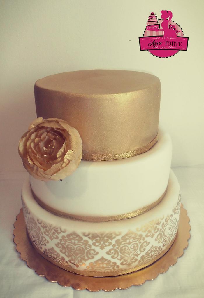 Gold white stencil wedding cake