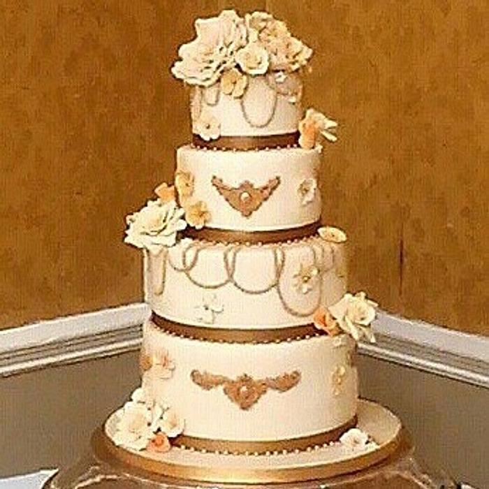 Gold and Cream wedding cake with a hint of peach