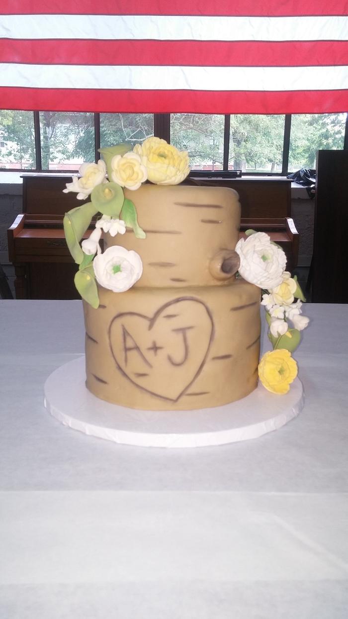 Light tree trunk wedding cake and cupcakes