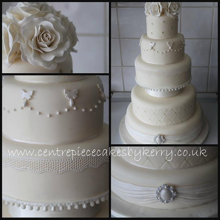 Vintage ivory wedding cake with white accents