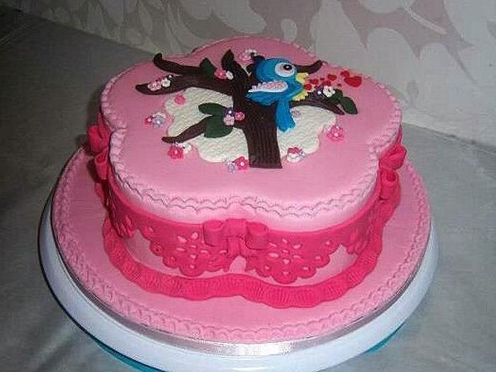 Pink cake with tree and bird