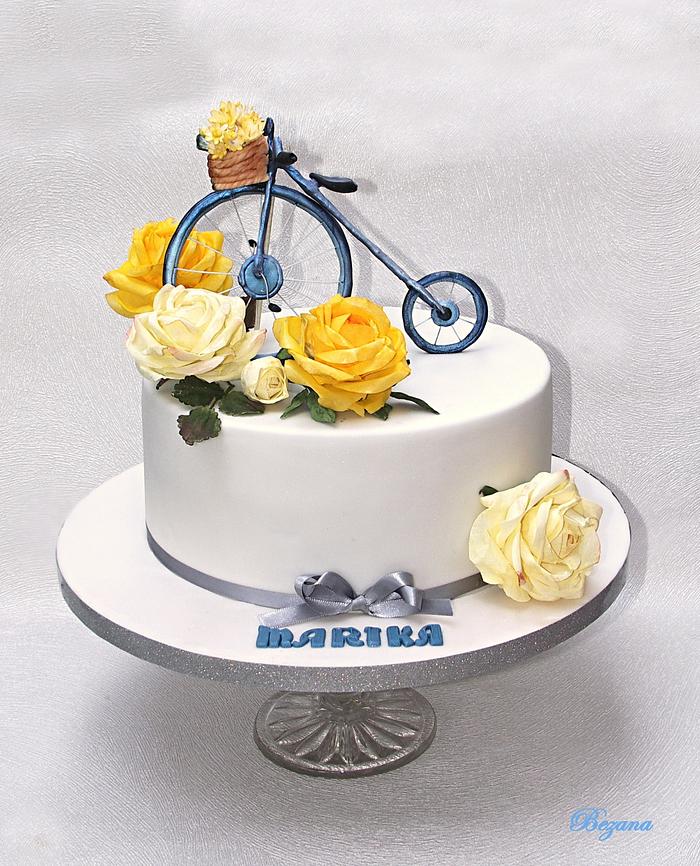 With paper roses and bicycle