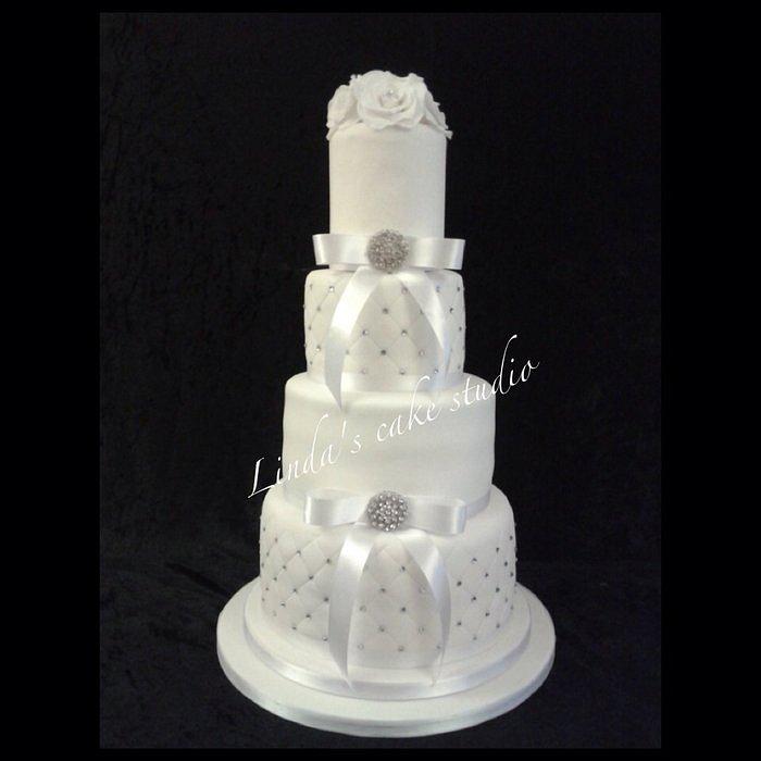 Elegant white bling 4 tier wedding cake