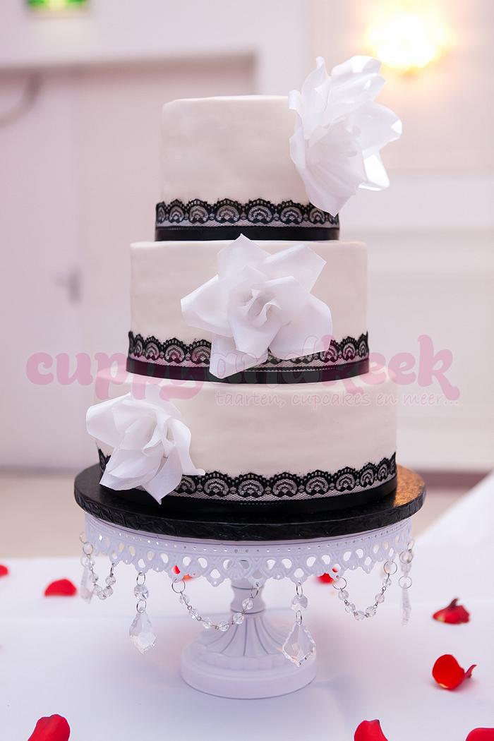 Romantic wedding cake with lace and roses