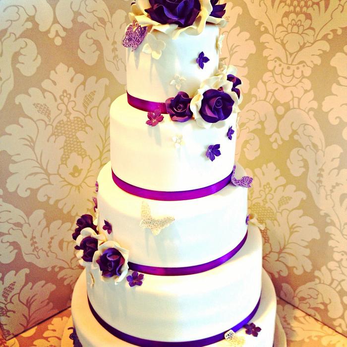 Ivory & purple 5 tier wedding cake