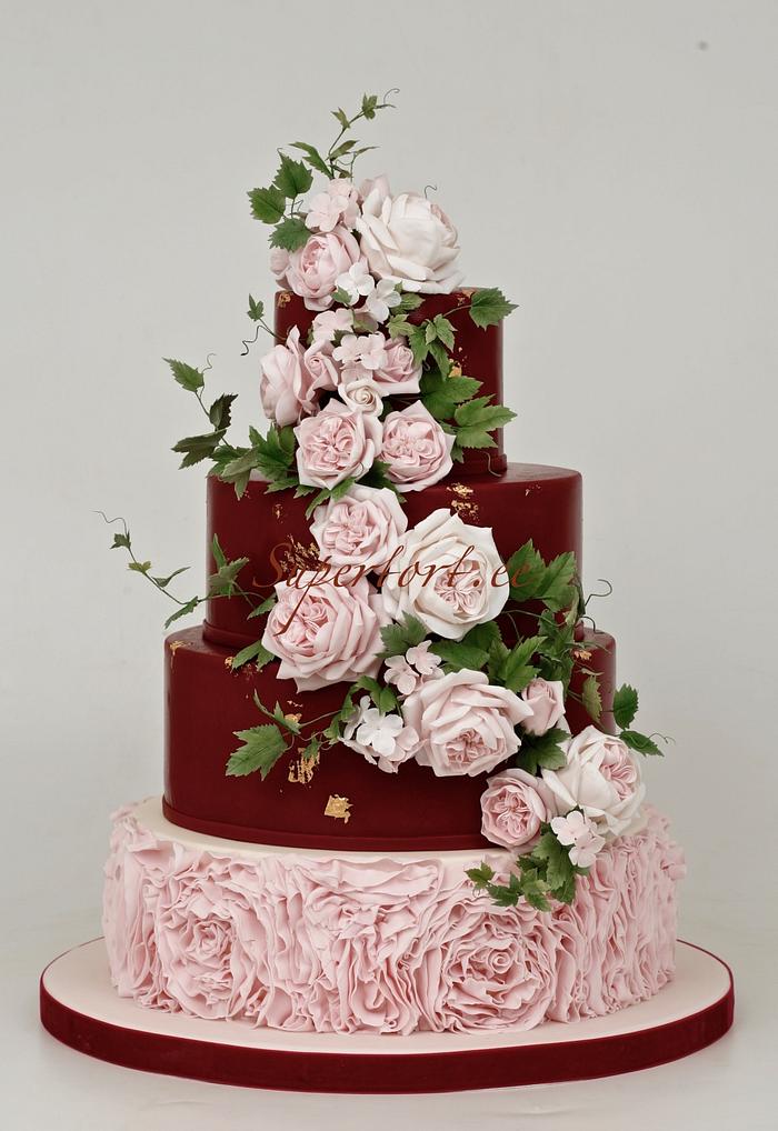 Marsala and pink wedding cake with english roses and ivy