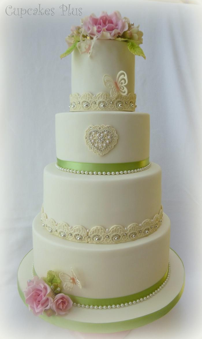 Pink and ivory wedding cake