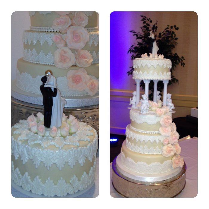 4 Tier wedding cake with fondant pearls. lace and champagne sugar roses