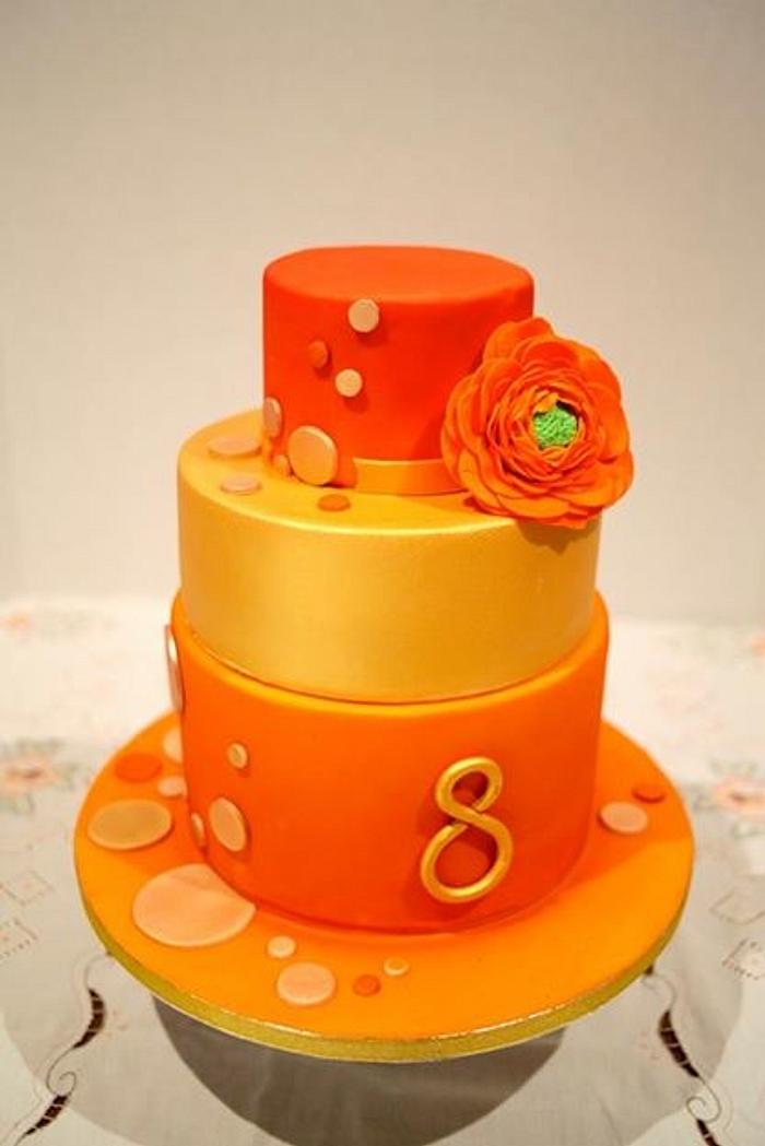 Orange and gold birthday cake