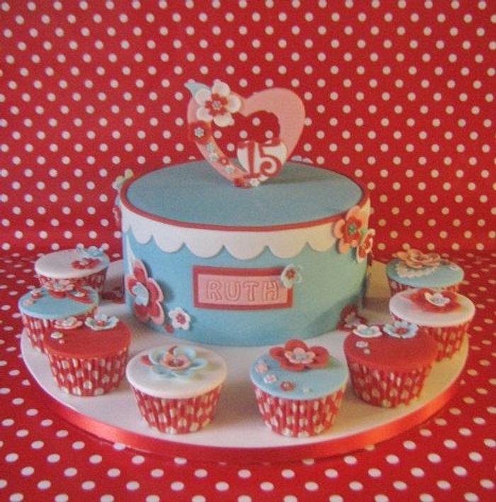 heart topper birthday cake and cupcakes