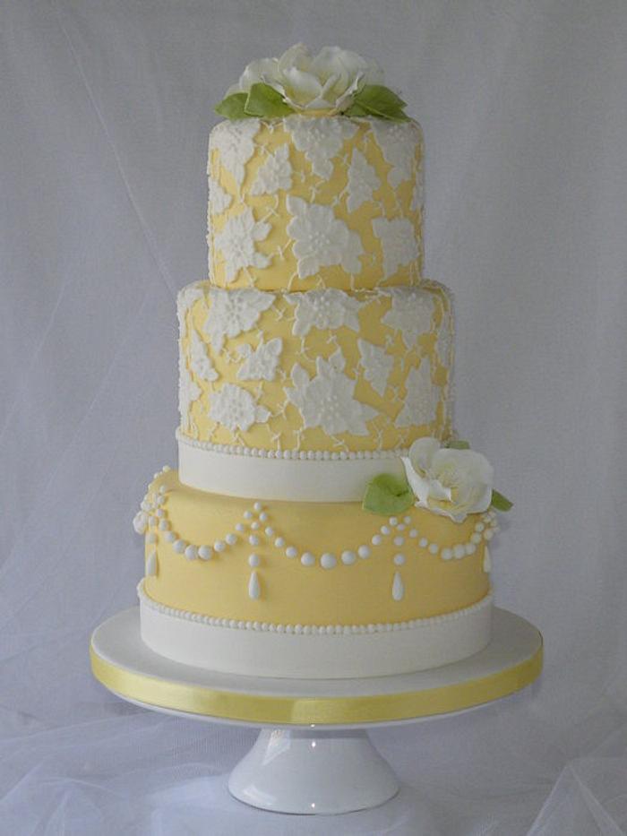 Yellow 3 tier cake with brush embroidery