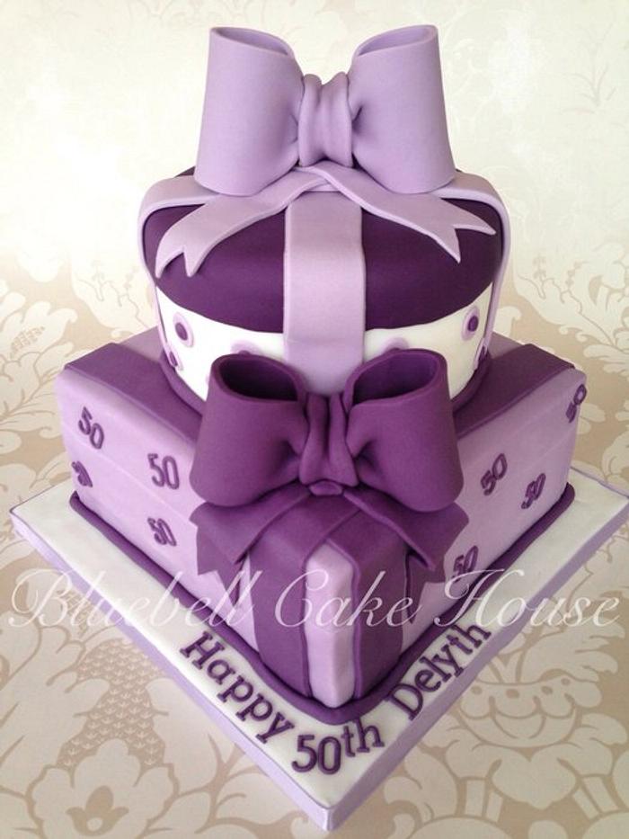 Luxurious purple parcel two tier birthday cake 