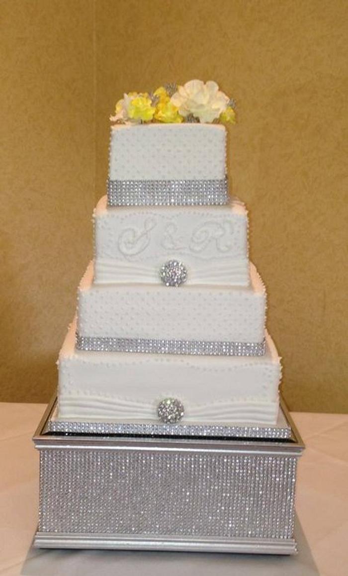 bling wedding cake with yellow hand made roses, diamante trimmings