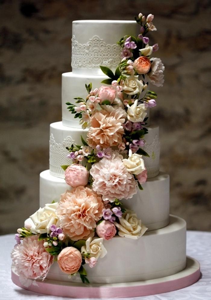 5 tiers wedding cake with peony, freesia and roses cascade