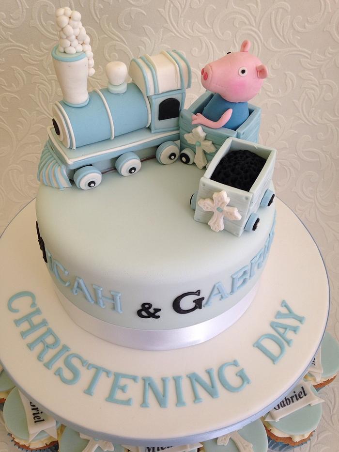 Little blue train with peppa pig's George and matching cup cakes .christening cake 