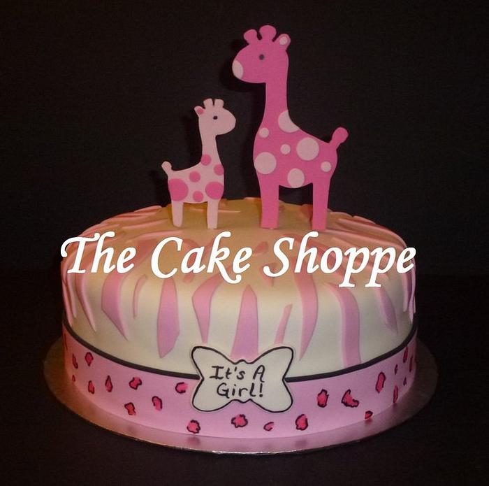Pink giraffe baby shower cake