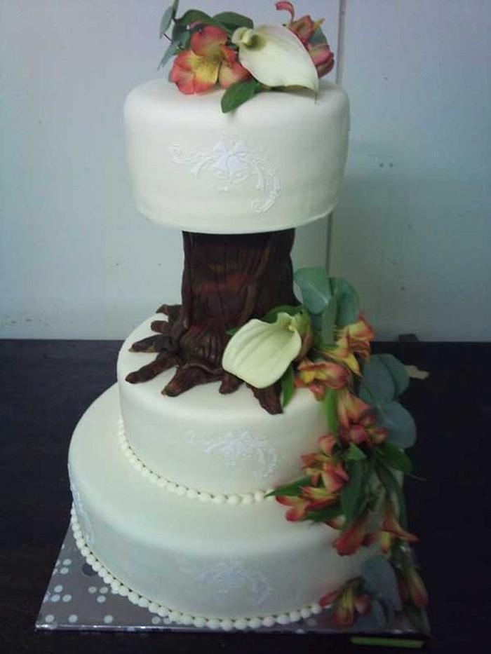 wedding cake with tree and flowers