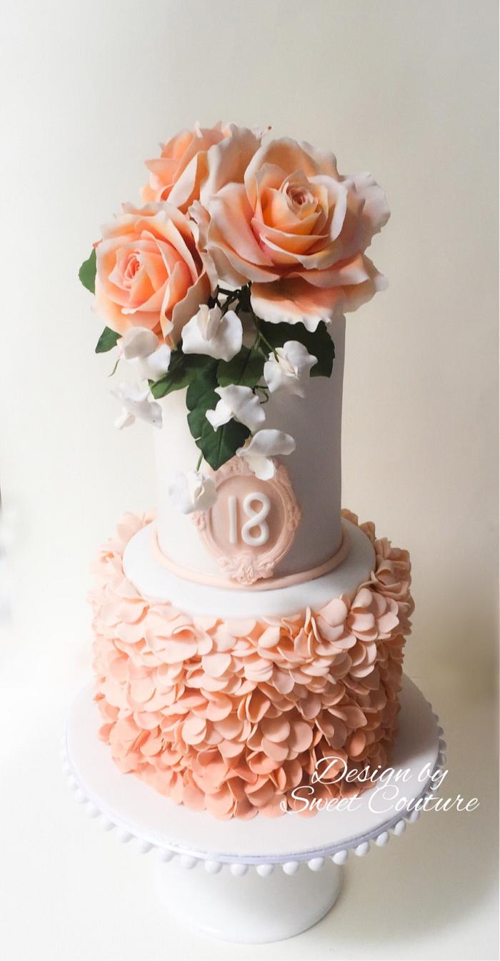 Peach coloured themed cake.