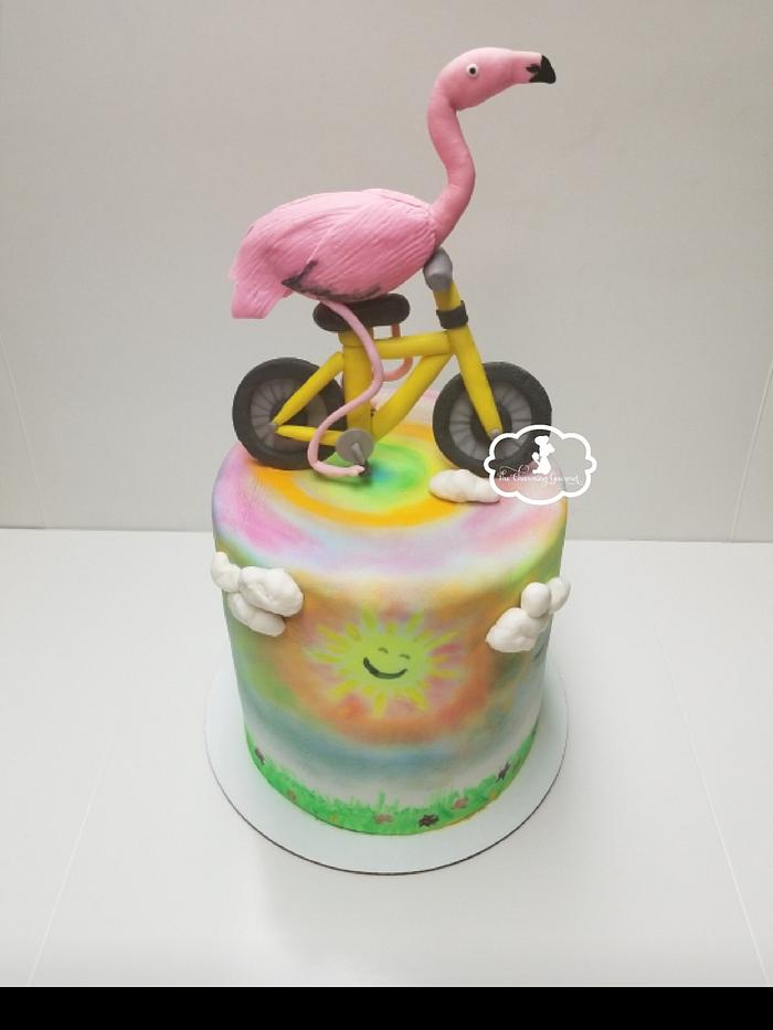 Flamingo on a bike cake