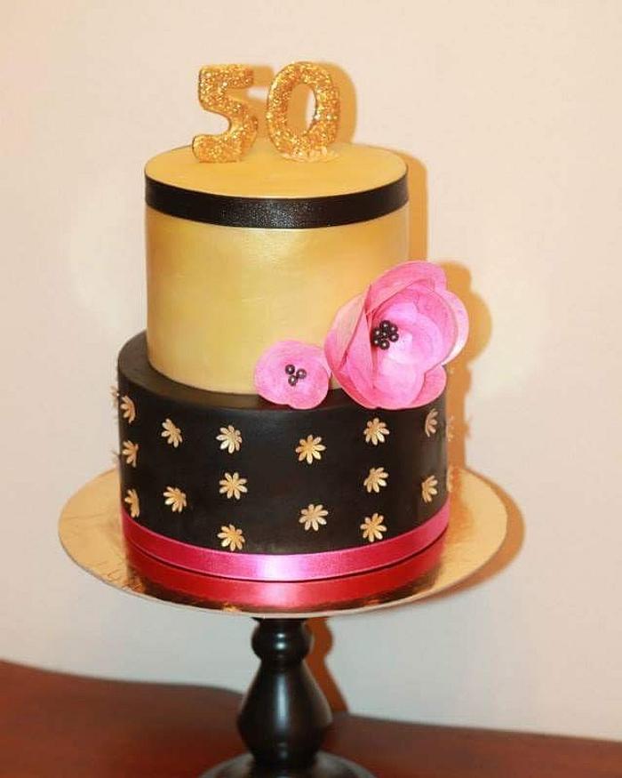 Gold and black 50th birthday cake..