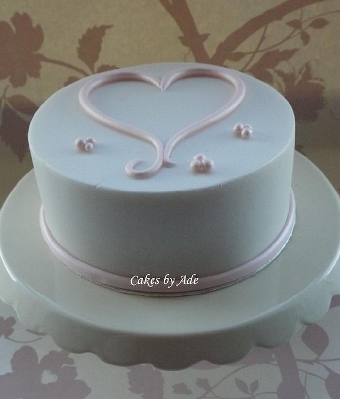 Simple lustre pink & white heart cake - February 2012