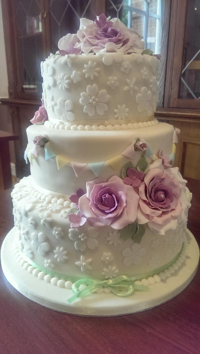 Rose and bunting wedding cake