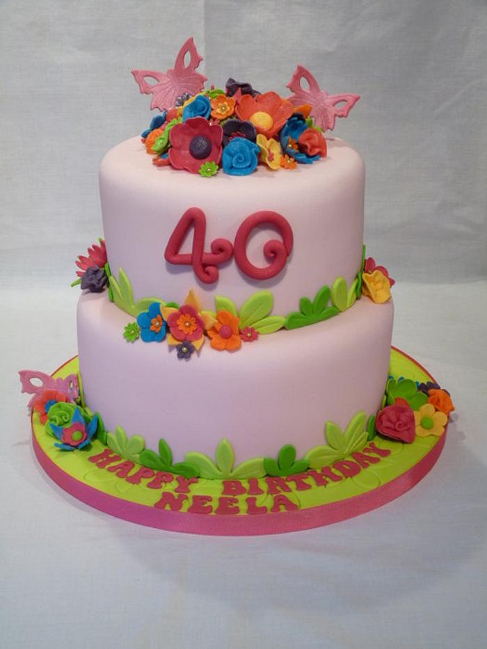 TWO TIERED BRIGHT COLOURED FLORAL CAKE