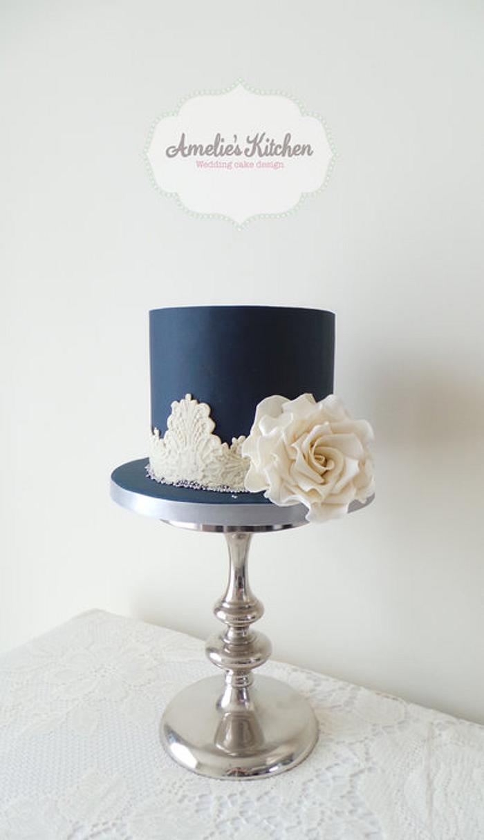 Navy blue and ivory lace wedding cake