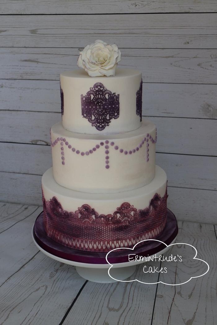 Wedding cake with purple lace and rose