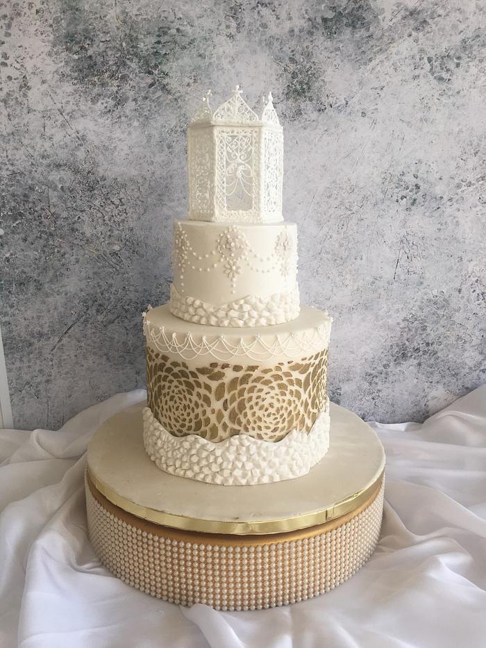 Gold and white wedding cake 