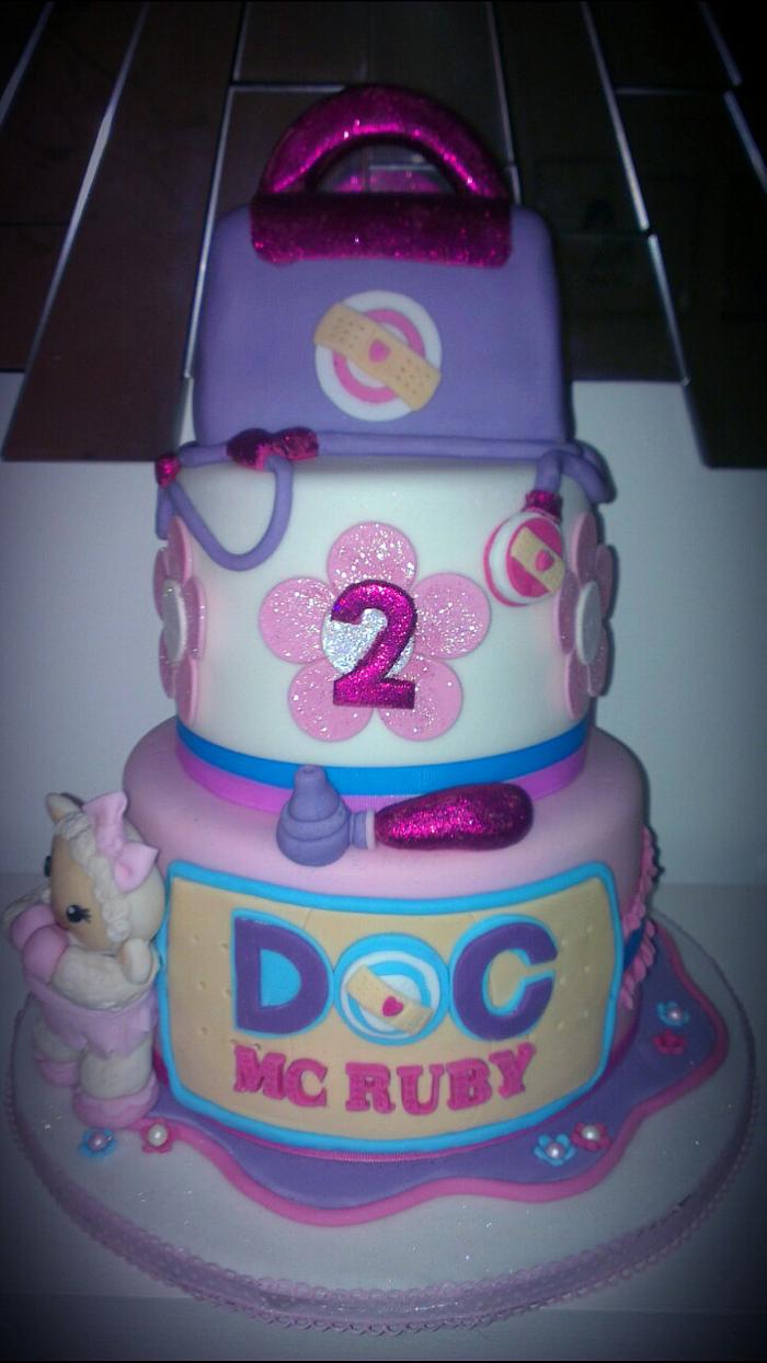 three tiered doc mcstuffin lambie girls birthday cake