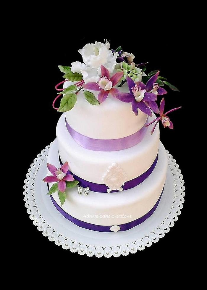 wedding cake with purple orchid