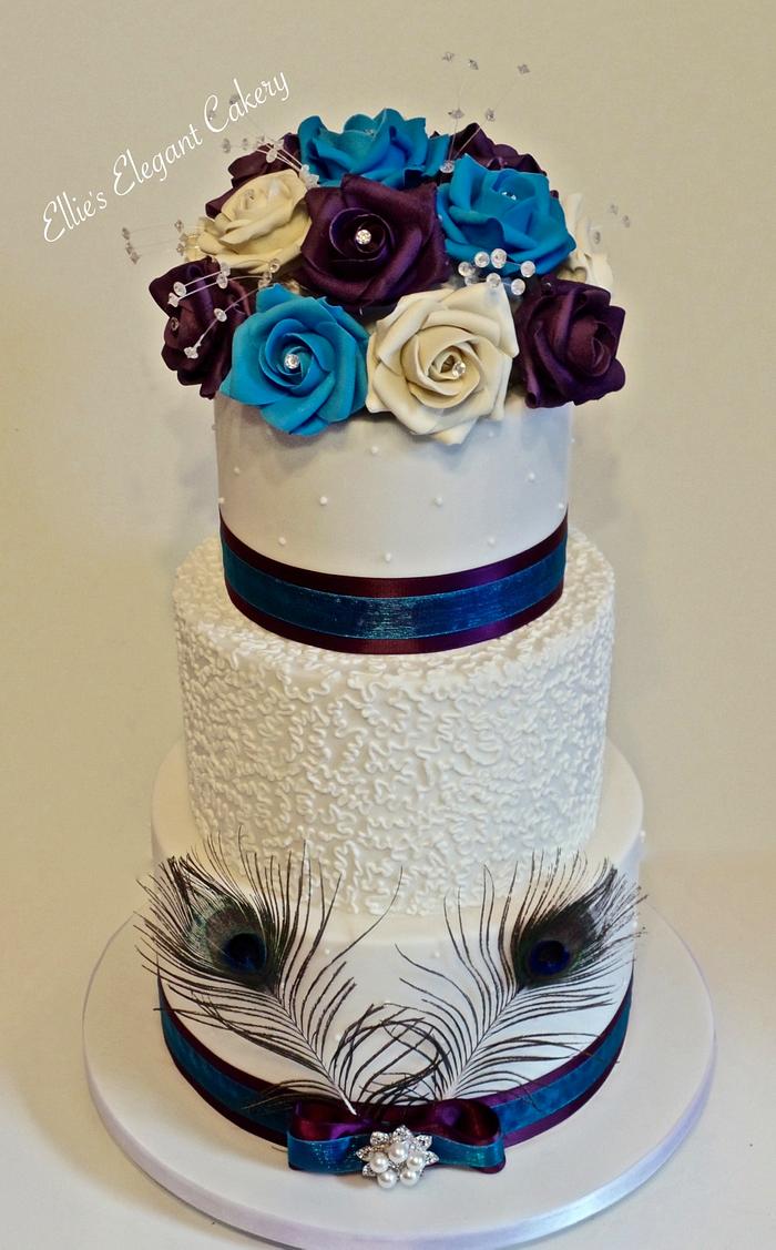 Peacock and roses wedding cake