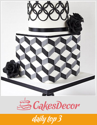 Modern black and white bridalshower cake with geometric patterns.