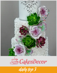 Wedding cake with succulents and roses