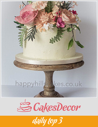 Corals, pinks and foliage natural wedding cake 